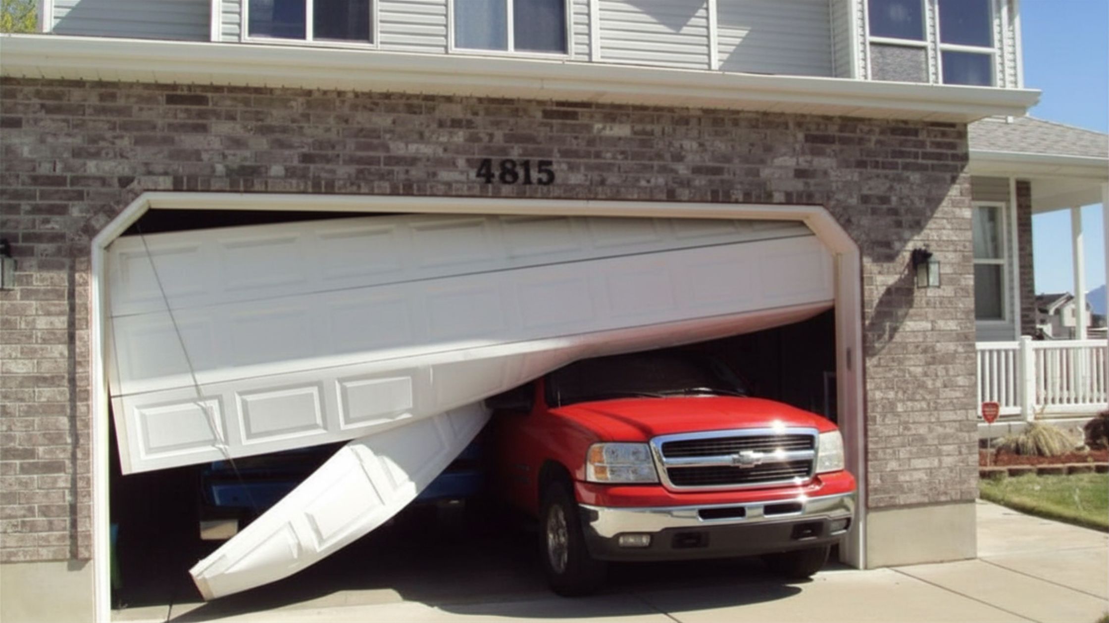 car hit garage door in San Antonio
