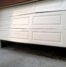 damaged garage door that needs to be repaired or replaced in San Antonio