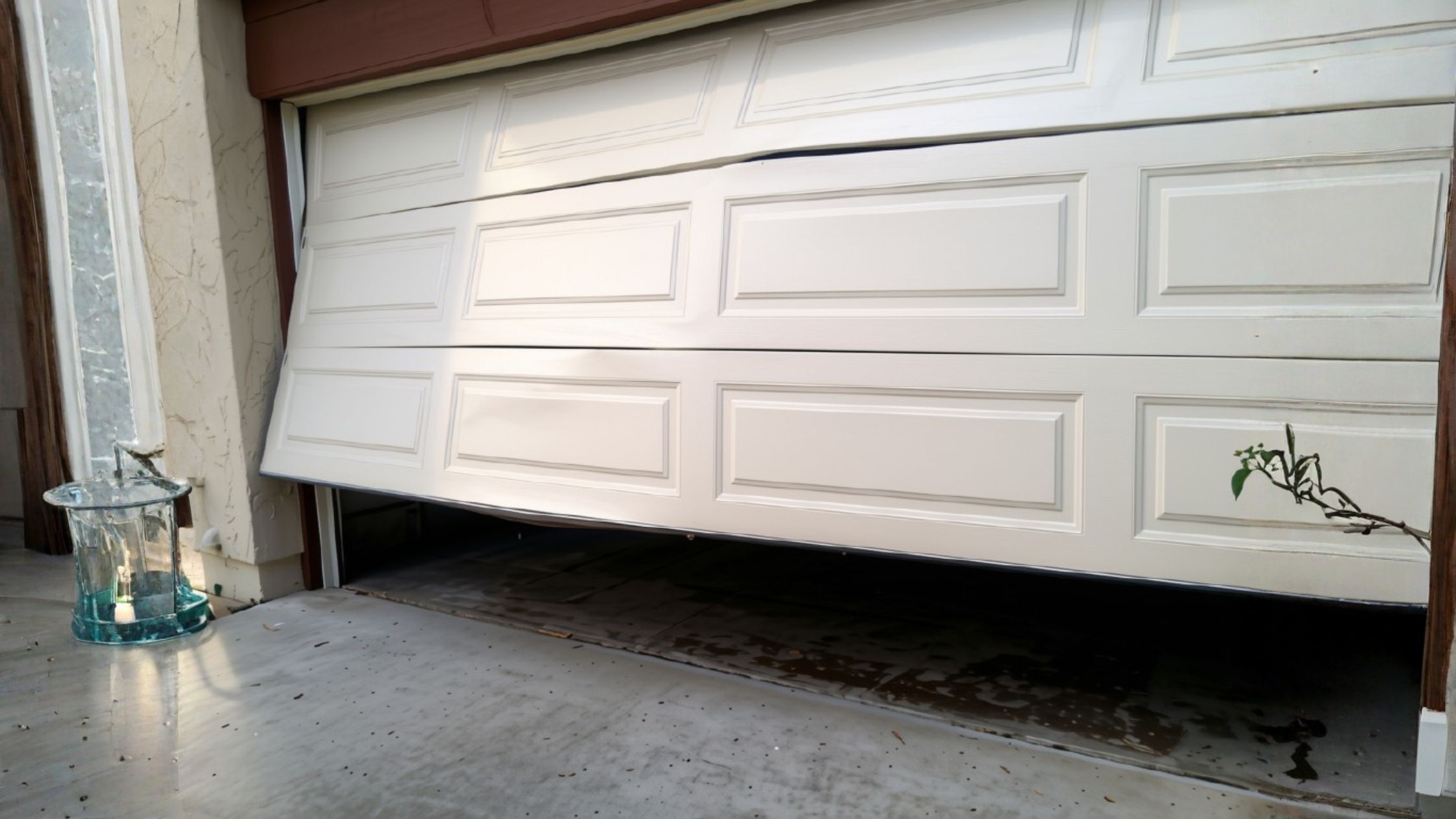damaged garage door that needs to be repaired or replaced in San Antonio