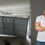 image of a garage door that's fallen off the track